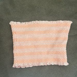 Pink and peach tube top for teens and young adults.